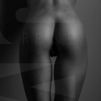 Vertical black and white fine art photo of nude woman from back, showing her naked body from her lower back to her upper thighs with the light reflecting off of her shapely buttocks.