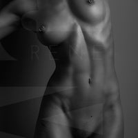 Black and white fine art photo of a nude woman standing facing the camera. The photo is cropped to show the model from her chin to her mid thigh.