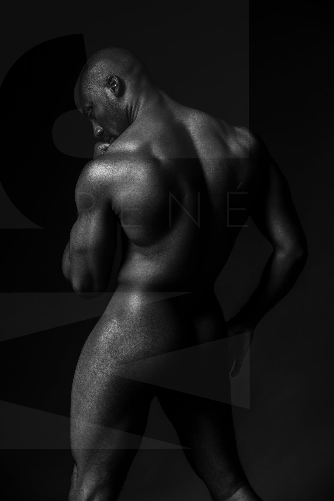 Black and white fine art photo of a nude black man posterior view from head to mid thigh with one arm bent and chin resting on closed fist.